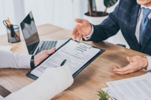 Injured worker filing workers compensation claim form.