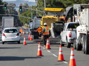 Road repairs on going along the highway with caution sign