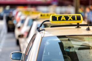 Taxis waiting for passengers in line up.