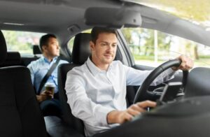 Ridesharing driver like uber picking up booked customers.