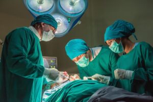 Surgeons teamwork operating critical patient.